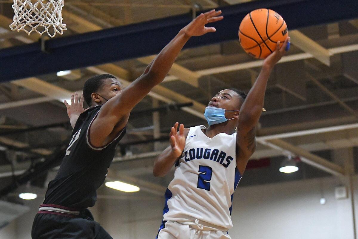 Wake Forest’s Wake Forest’s Dashaun Grant (2) attempts the layup against Wakefield’s Dominic Haney (12) during the second half. The Wakefield Wolverines and the Wake Forest Cougars met in a conference basketball game in Wake Forest, NC on January 14, 2022.