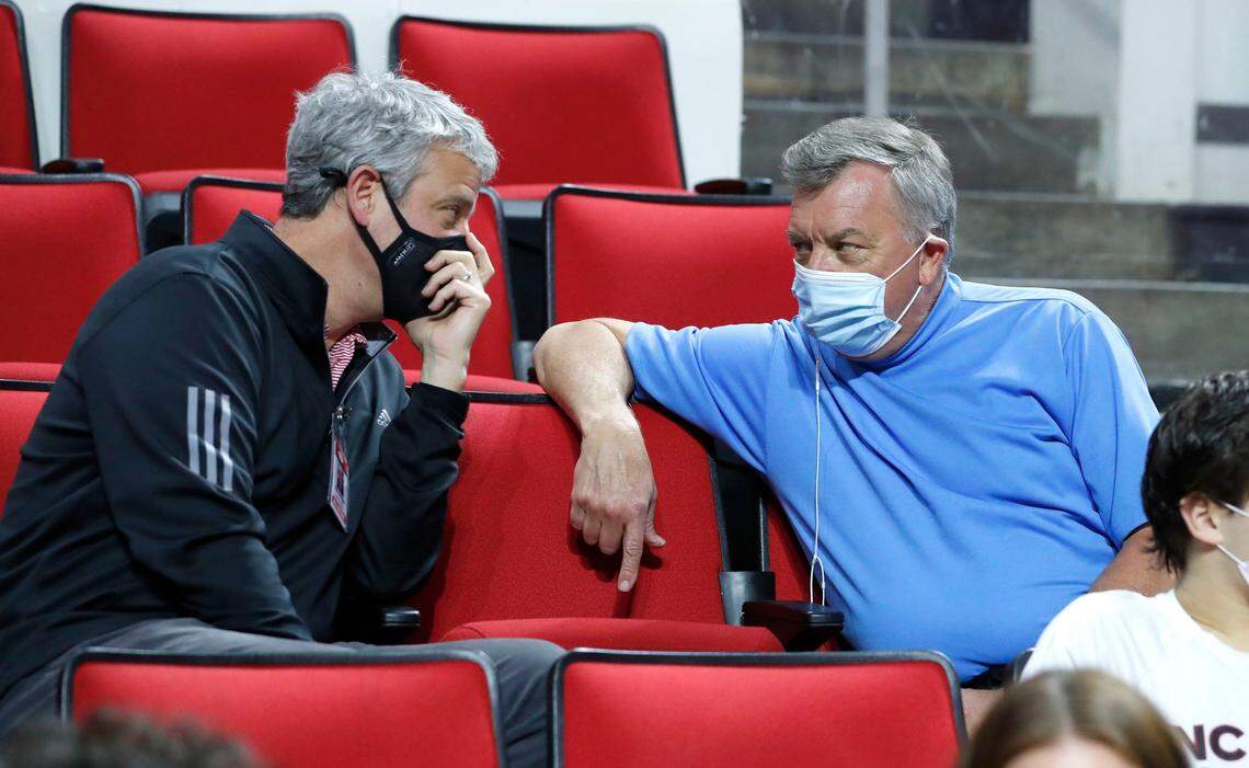 N.C. States Director of Athletics Boo Corrigan talks with Don Waddell, general manger of the Hurricanes, during N.C. States game against Pittsburgh at PNC Arena in Raleigh, N.C., Sunday, February 28, 2021.