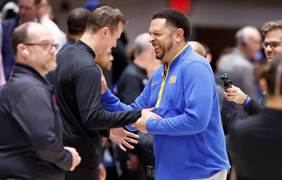 Duke head coach Jon Scheyer laughs with Pittsburgh head coach Jeff Capel before Duke’s game against Pitt at Cameron Indoor Stadium in Durham, N.C., Tuesday, Jan. 7, 2025.