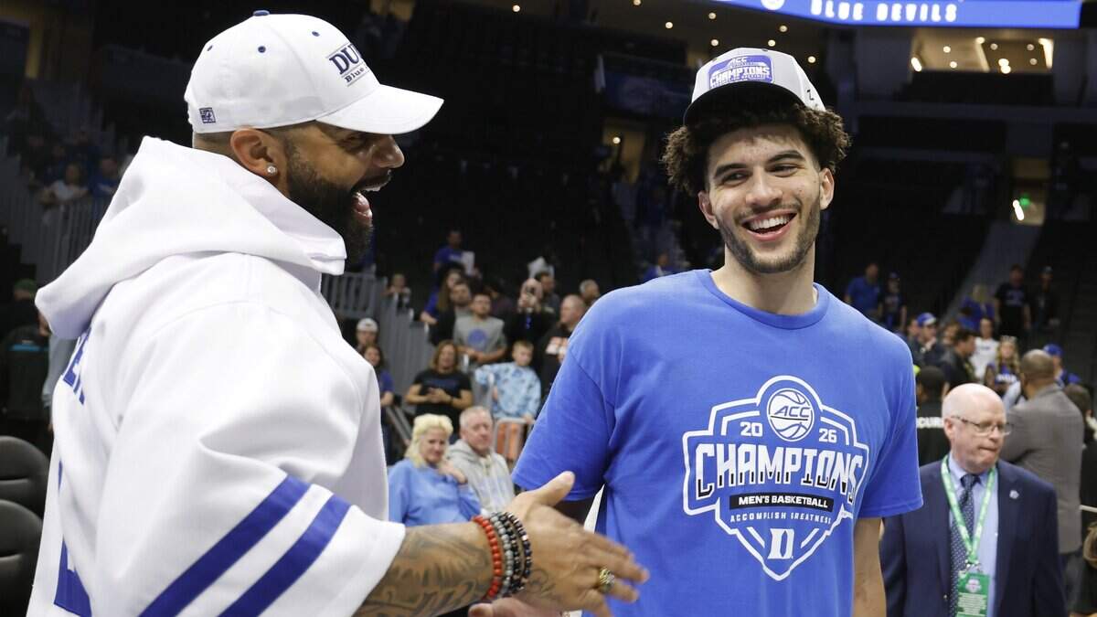 Carlos Boozer congratulates his son Cameron Boozer after Duke’s 74-70 victory over Virginia in the finals of the 2026 ACC Men’s Basketball Tournament at the Spectrum Center in Charlotte, N.C., Saturday, March 14, 2026.