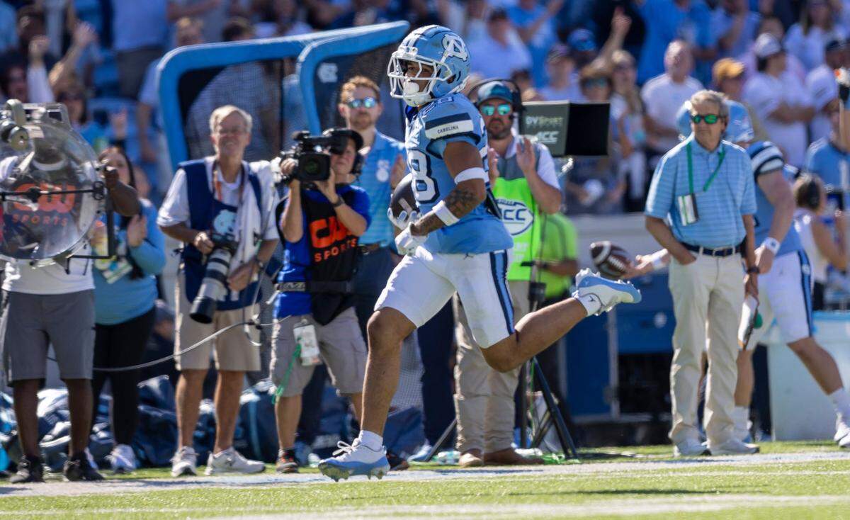 North Carolina defensive back Alijah Huzzie (28) returns a punt 69 yards for a touchdown in the third quarter against Georgia Tech on Saturday, October 12, 2024 at Kenan Stadium in Chapel Hill, N.C.