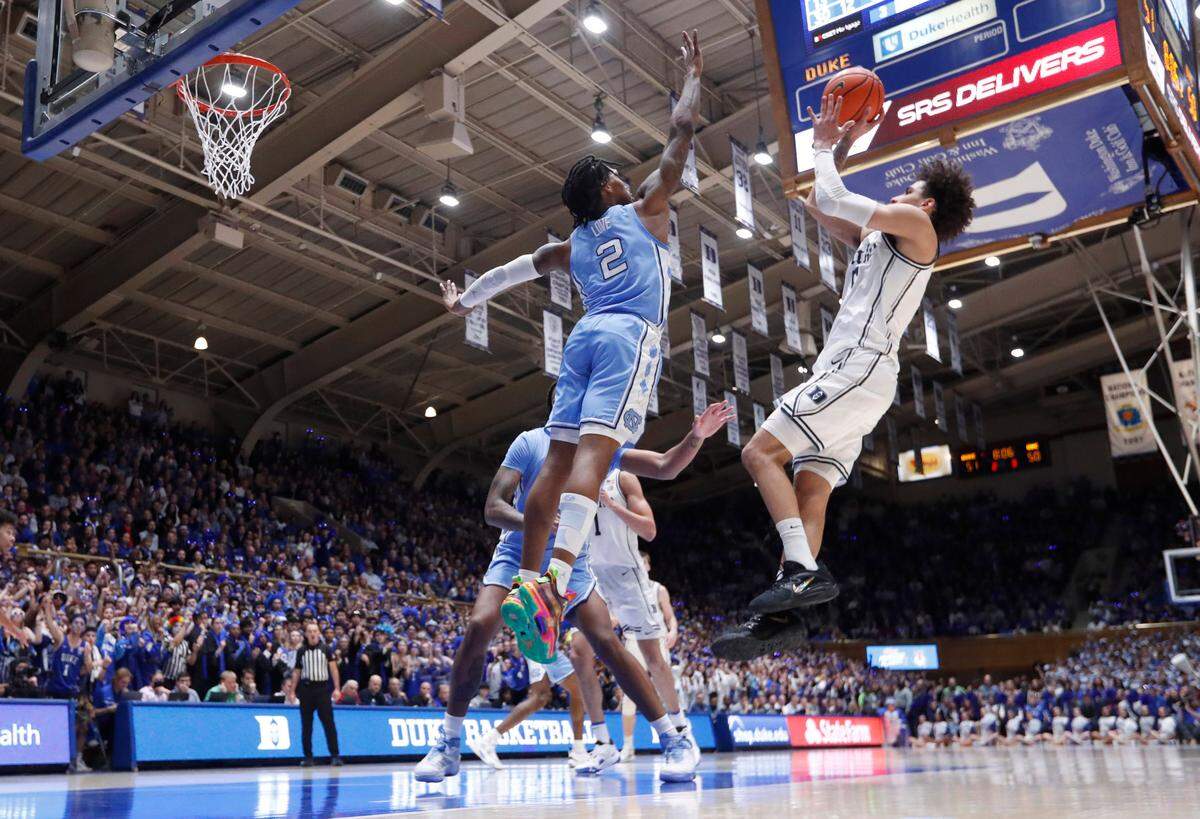 Duke’s Tyrese Proctor (5) shoots as North Carolina’s Caleb Love (2) during Duke’s 63-57 victory over UNC at Cameron Indoor Stadium in Durham, N.C., Saturday, Feb. 4, 2023.