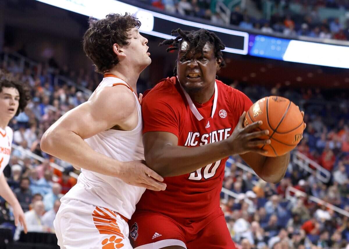 N.C. State’s D.J. Burns Jr. (30) works against Clemson’s PJ Hall (24) during the first half of N.C. State’s game against Clemson in the quarterfinals of the ACC Men’s Basketball Tournament in Greensboro, N.C., Thursday, March 9, 2023.