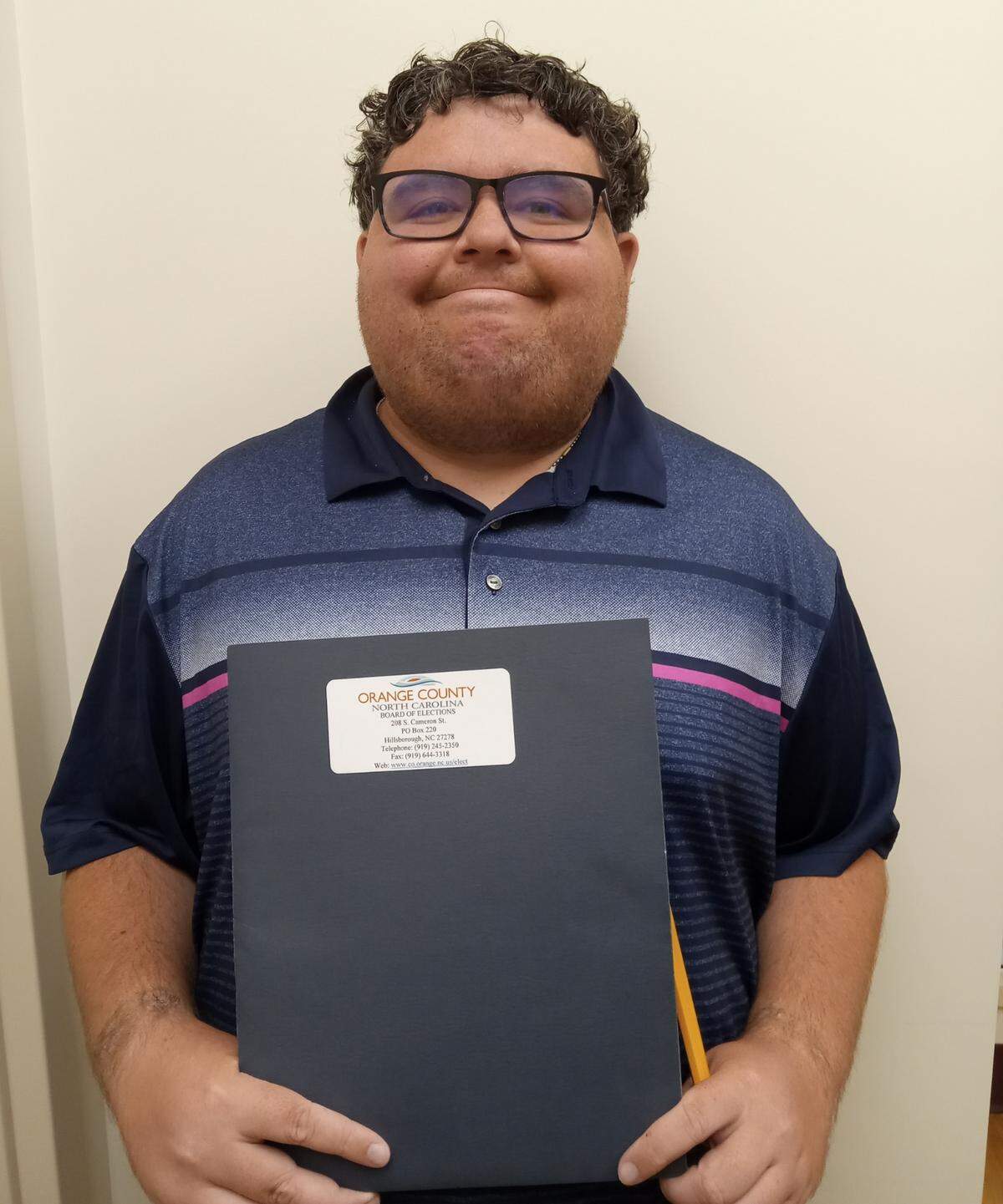 Isaac Woolsey, 30, is a disability rights advocate running for Carrboro town council.