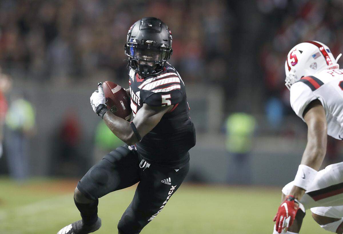 N.C. State’s Tabari Hines (5) makes a 19-yard reception before being tackled by Ball State cornerback Tyler Potts (15) during the first half of N.C. State’s game against Ball State at Carter-Finley Stadium in Raleigh, N.C. Saturday, Sept. 21, 2019.