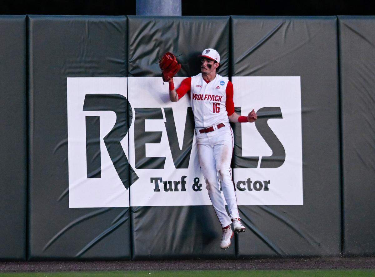 N.C. State’s Eli Serrano III (16) catches a fly ball during N.C. State’s 9-2 victory against Bryant in the NCAA Raleigh Regional at Doak Field on Friday, May 31, 2024.