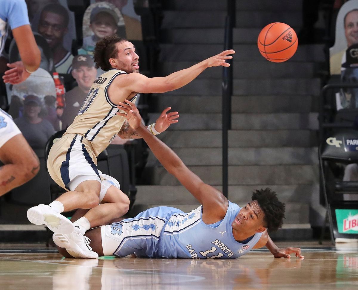 Georgia Tech guard Jose Alvarado steals the ball from North Carolina forward Day’Ron Sharpe during the first half of an NCAA college basketball game Wednesday, Dec. 30, 2020, in Atlanta.