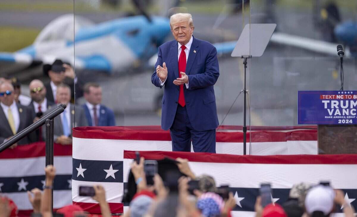 Former President Donald Trump takes the stage during a rally at the North Carolina Aviation Museum & Hall of Fame in Asheboro, NC on Wednesday, Aug. 21, 2024.
