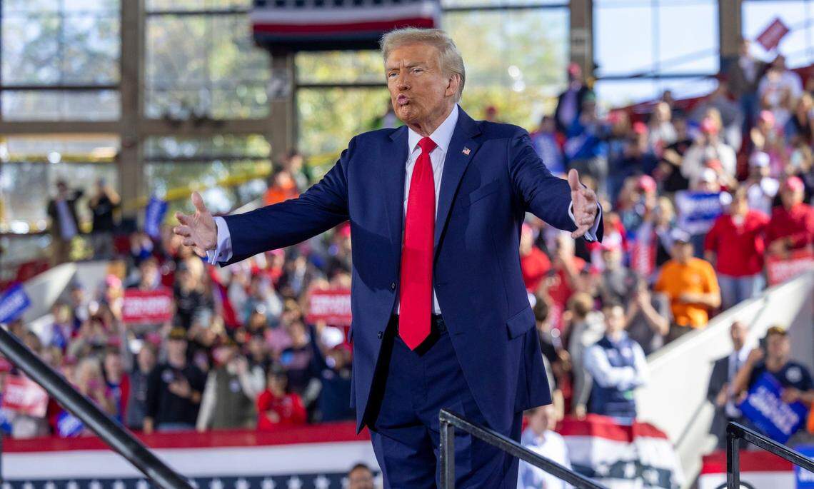 Republican presidential nominee and former President Donald Trump leaves the stage following a rally at Dorton Arena in Raleigh on Monday, Nov. 4, 2024, one day before Election Day.