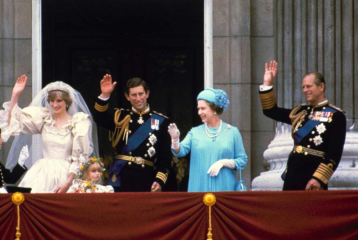 Prince Charles and his bride Diana, Princess of Wales, wave from the balcony of Buckingham Palace after their marriage July 29, 1981, at St. Paul’s Catheral.