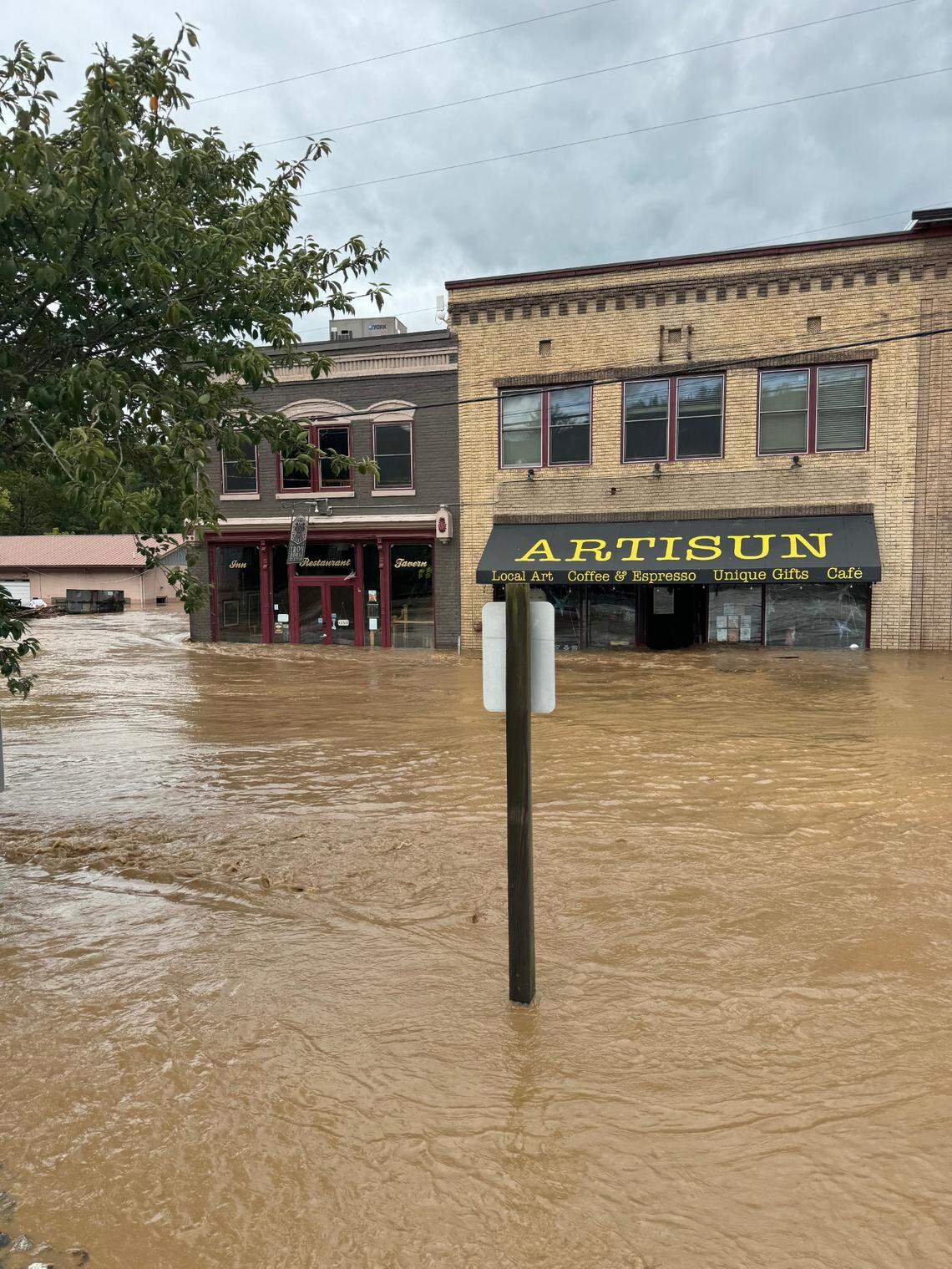 Flood waters from Helene have cut off roads in and out of Hot Springs, N.C., northwest of Asheville, leaving those in town with no running water, no cell service and no power.