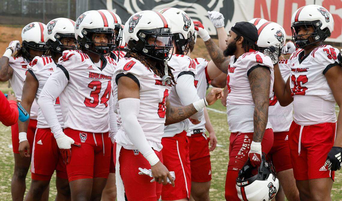 N.C. State linebacker Sean Brown (0) huddles with the linebackers during the Wolfpack’s first spring practice Tuesday, Feb. 27, 2024.