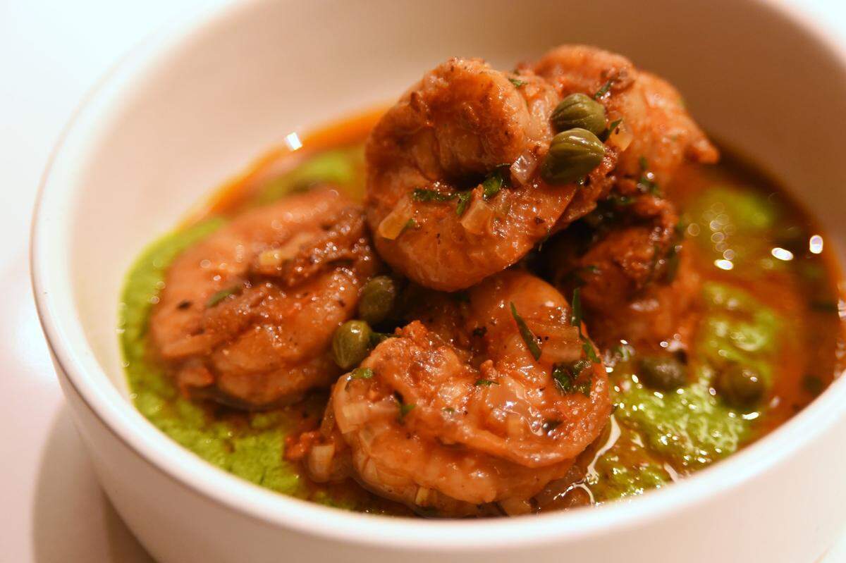 A plate of chilled garlic shrimp is on the opening menu of Proximo, the latest restaurant from Chapel Hill chef Brandon Sharp.