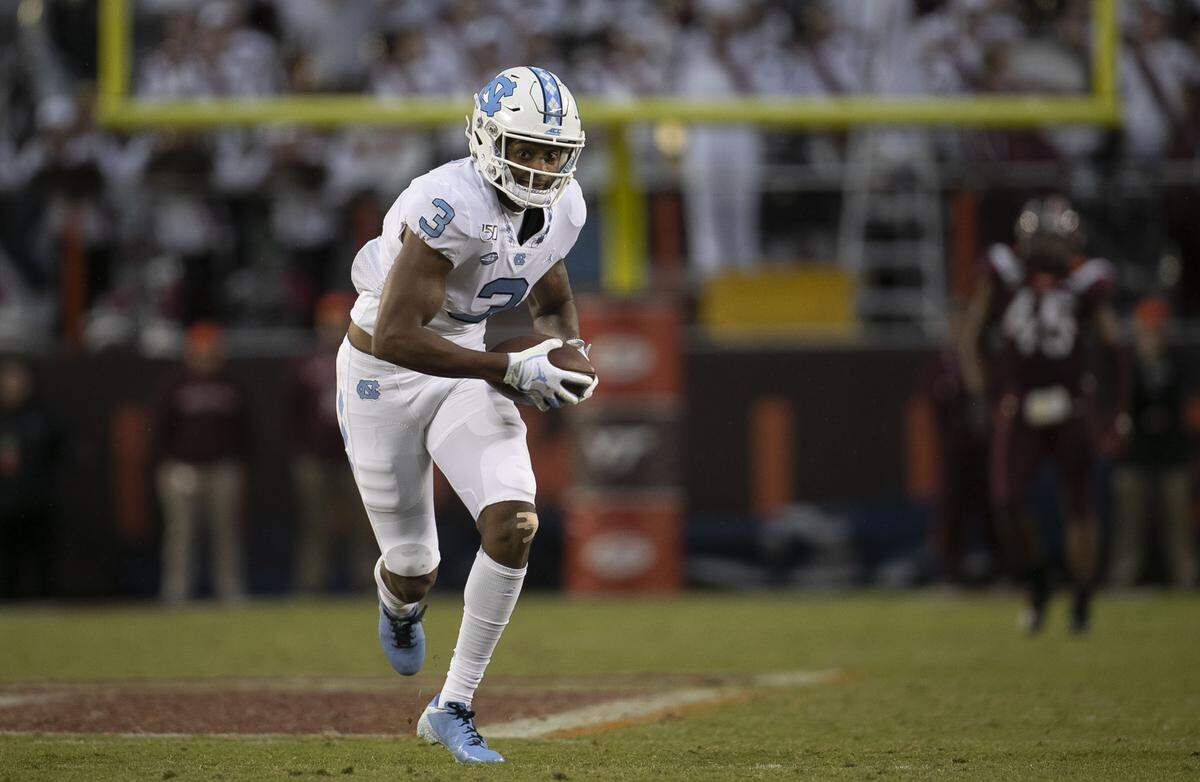 North Carolina’s Antoine Green (3) romps on a 68-yard pass completion from quarterback Sam Howell (7) for a touchdown to give the Tar Heels a 31-24 lead in the fourth quarter on Saturday, October 19, 2019 at Lane Stadium in Blacksburg, Va.