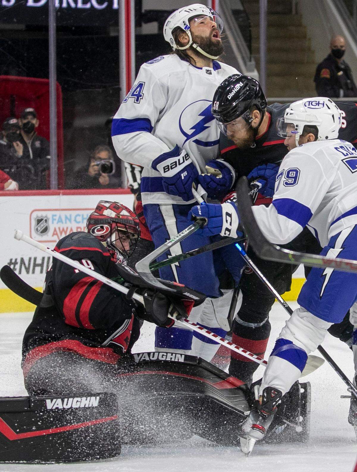 Carolina Hurricanes’ Jani Hakanpaa (58) collides with Tampa Bay’s Pat Maroon (14) pushing him into Carolina Hurricanes goalie Alex Nedeljkovic (39) during the first period in game five of their Stanley Cup series against Tampa Bay on Tuesday, June 8, 2021 at PNC Arena in Raleigh, N.C.