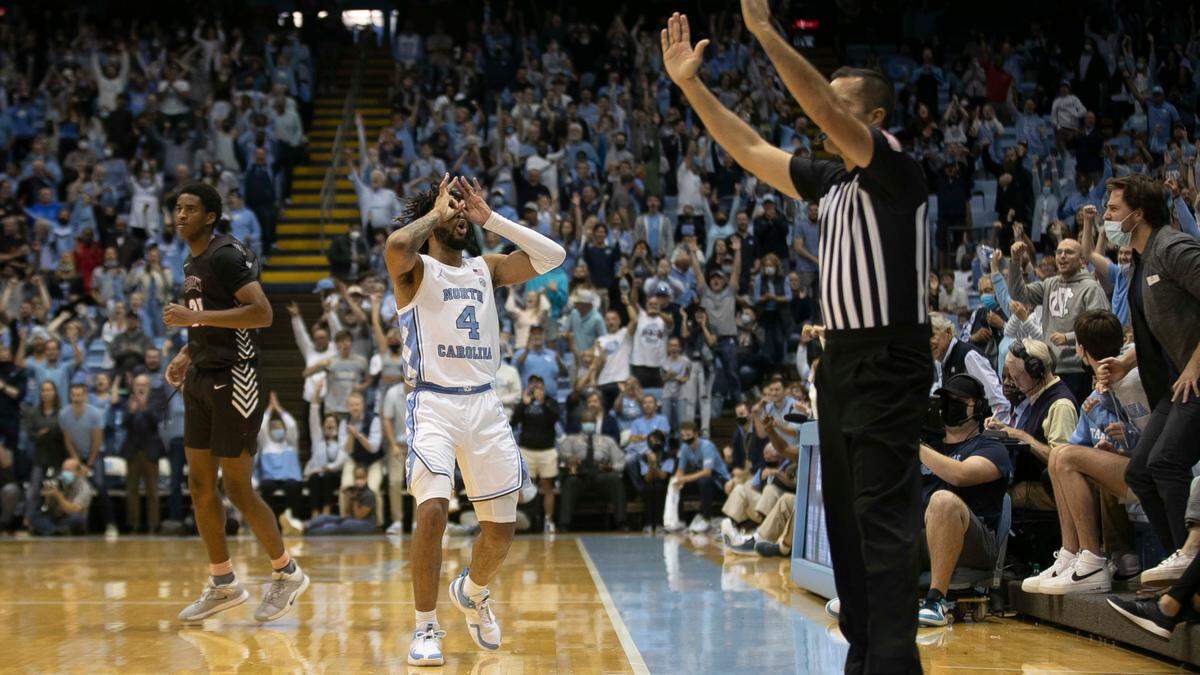 North Carolina’s R.J. Davis (4) reacts after sinking a three-point basket late in the second half to secure a victory against Brown on Friday, November 12, 2021 at the Smith Center in Chapel Hill, N.C. Davis lead the Tar Heels with 26 points in their 94-87 victory.