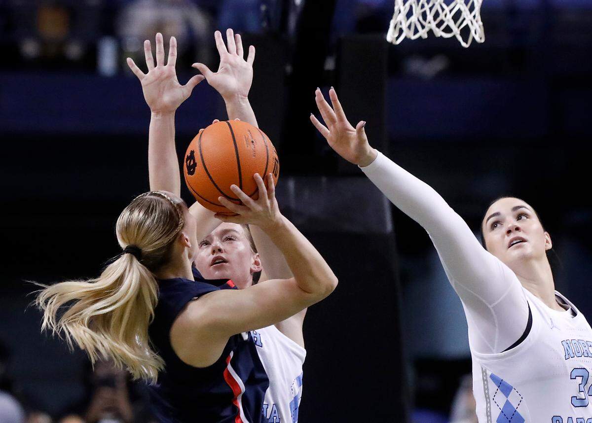 North Carolina’s Lexi Donarski and Blanca Thomas pressure UConn’s Paige Bueckers during the first half of the Tar Heels’ 69-58 loss on Friday, Nov. 15, 2024, at First Horizon Coliseum in Greensboro, N.C.