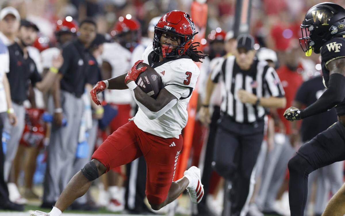 N.C. State running back Hollywood Smothers (3) gains yards during the first half of N.C. State’s game against Wake Forest at Allegacy Stadium in Winston-Salem, N.C., Thursday, Sept. 11, 2025.