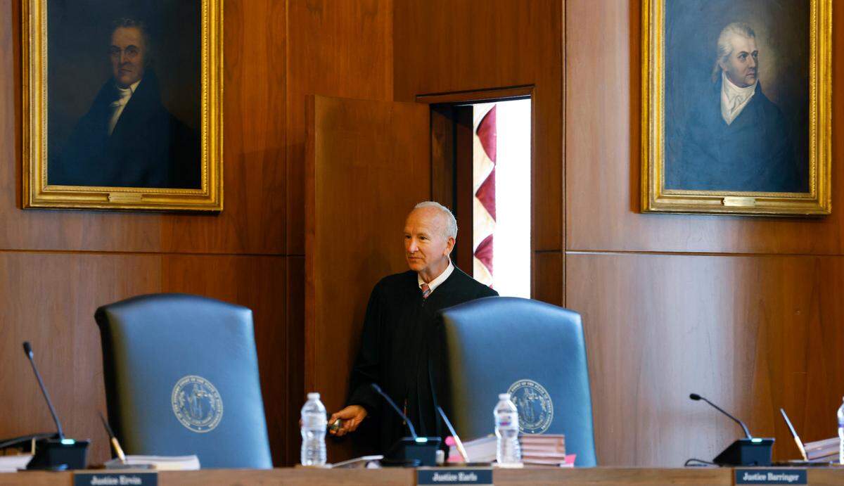 Chief Justice Paul Newby enters the courtroom before oral arguments at the North Carolina Supreme Court in Raleigh on May 9, 2022.