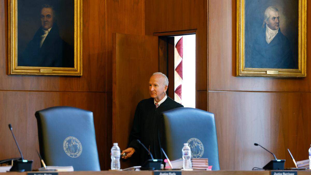 Chief Justice Paul Newby enters the courtroom before oral arguments at the North Carolina Supreme Court in Raleigh on May 9, 2022.