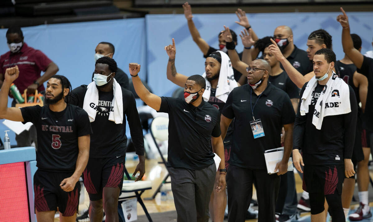 Members of the North Carolina Central University basketball team point to the North Carolina Tar Heels at the conclusion of their game on Saturday, December 12, 2020 at the Smith Center in Chapel Hill, N.C. North Carolina defeated NCCU 73-67.