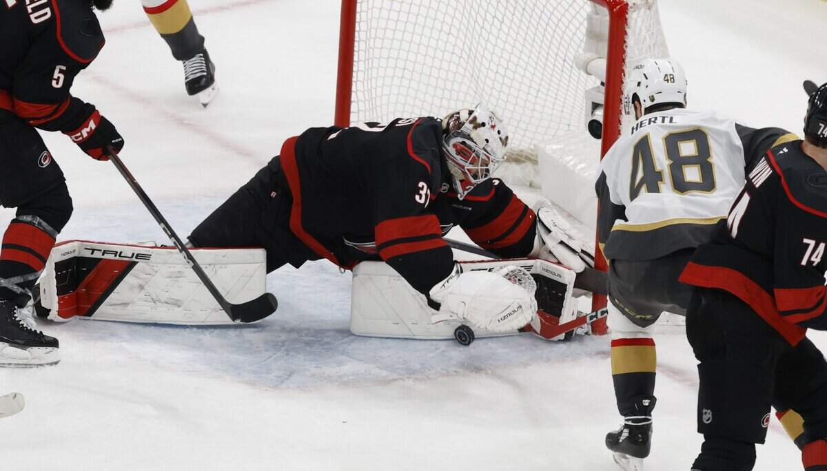 Carolina's Brandon Bussi (32) makes the save on the shot by Vegas’ Tomas Hertl (48) in the third period of the Hurricanes’ 4-2 victory over the Golden Knights in the fifth game of the Stanley Cup Final at the Lenovo Center in Raleigh, N.C., Thursday, June 11, 2026.