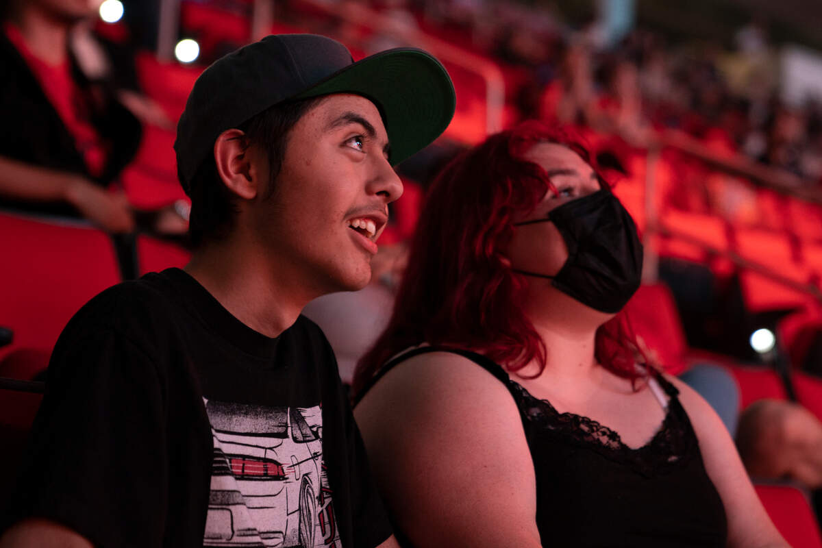 Marley Sanchez (left) and Jayla Harper, a 14-year-old couple from California, watch the Apex Legends Global Series Championship at the PNC Arena in Raleigh, N.C. on Thursday, July 7, 2022.