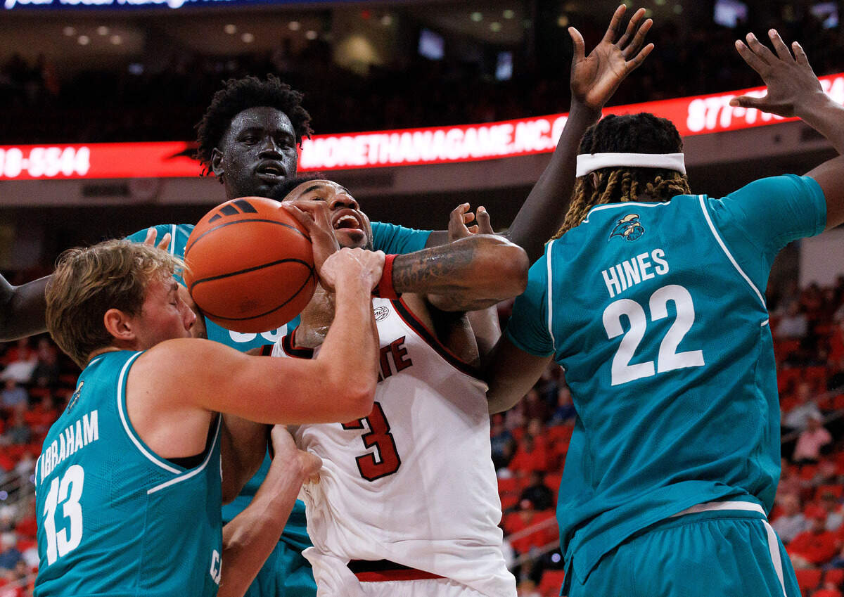 N.C. State’s Dontrez Styles is fouled as he pulls down a rebound during the first half of the Wolfpack’s game against Coastal Carolina on Wednesday, Nov. 13, 2024, at Lenovo Center in Raleigh, N.C.
