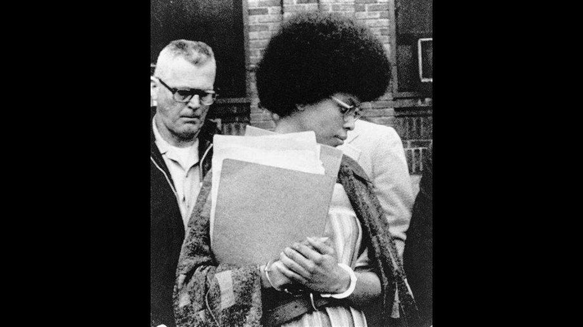 FILE - In this April 25, 1977, file photo, Joanne Chesimard, member of the Black Panther Party and Black Liberation Army, leaves Middlesex County courthouse in New Brunswick, N.J. Now known as Assata Shakur, Chesimard was convicted in 1977 of killing a New Jersey state trooper four years earlier, and was sentenced to life in prison but escaped and wound up in Cuba in the 1980s, where she continues to reside.
