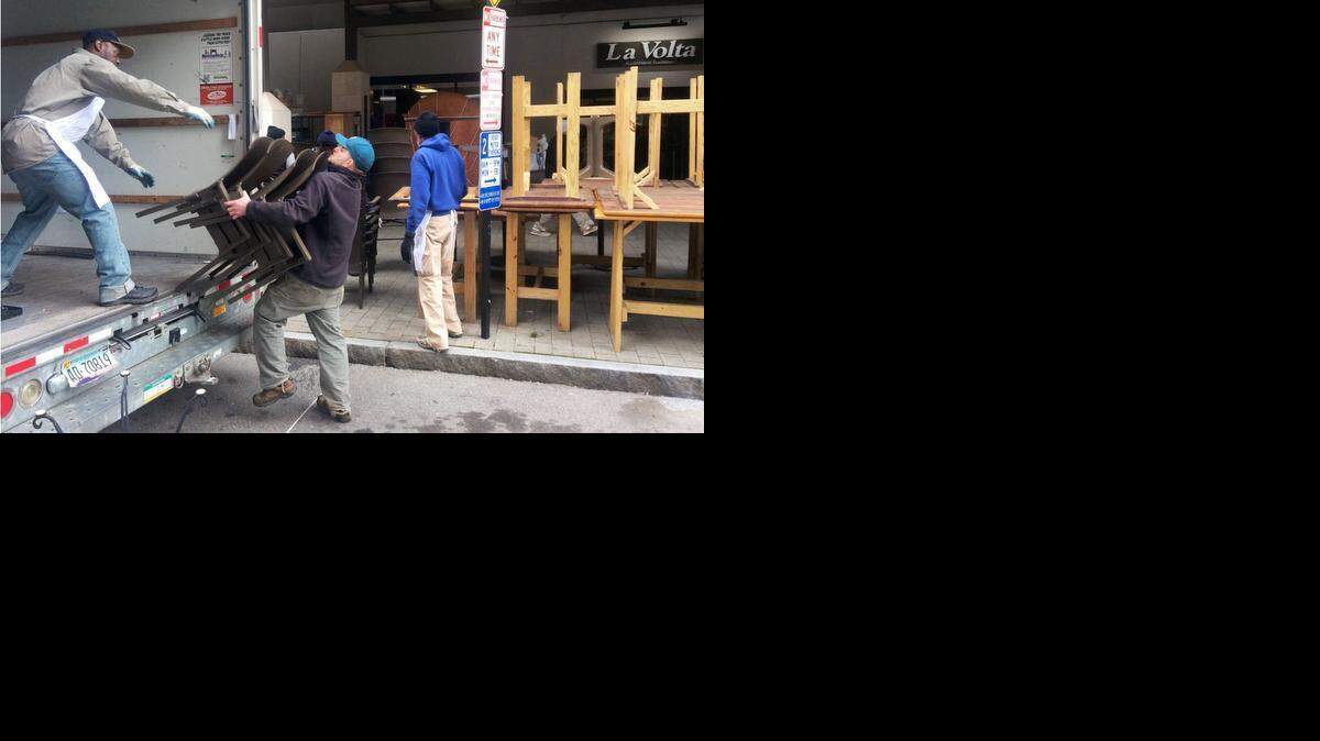 A crew loads equipment from the La Volta restaurant on Fayetteville Street in Raleigh on Wednesday. La Volta is closing and reopening as a Caribbean-themed restaurant in February.
