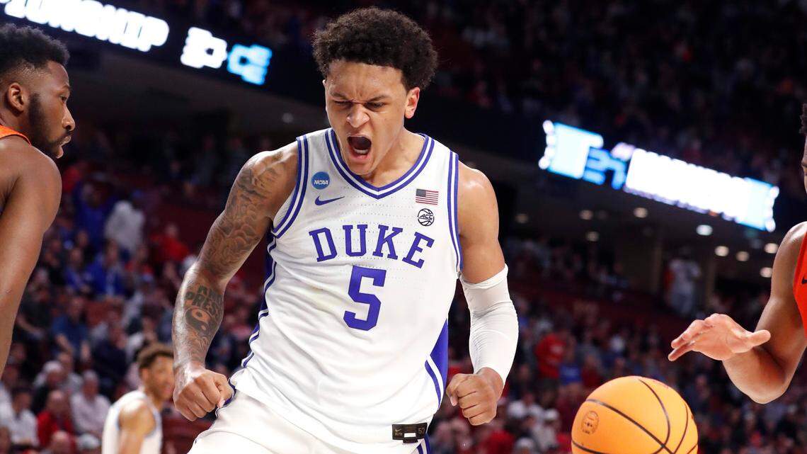 Duke’s Paolo Banchero (5) celebrates after slamming in two during the first half of Duke’s game against Cal State Fullerton in the first round of the NCAA Tournament at Bon Secours Wellness Arena in Greenville, S.C., Friday, March 18, 2022.
