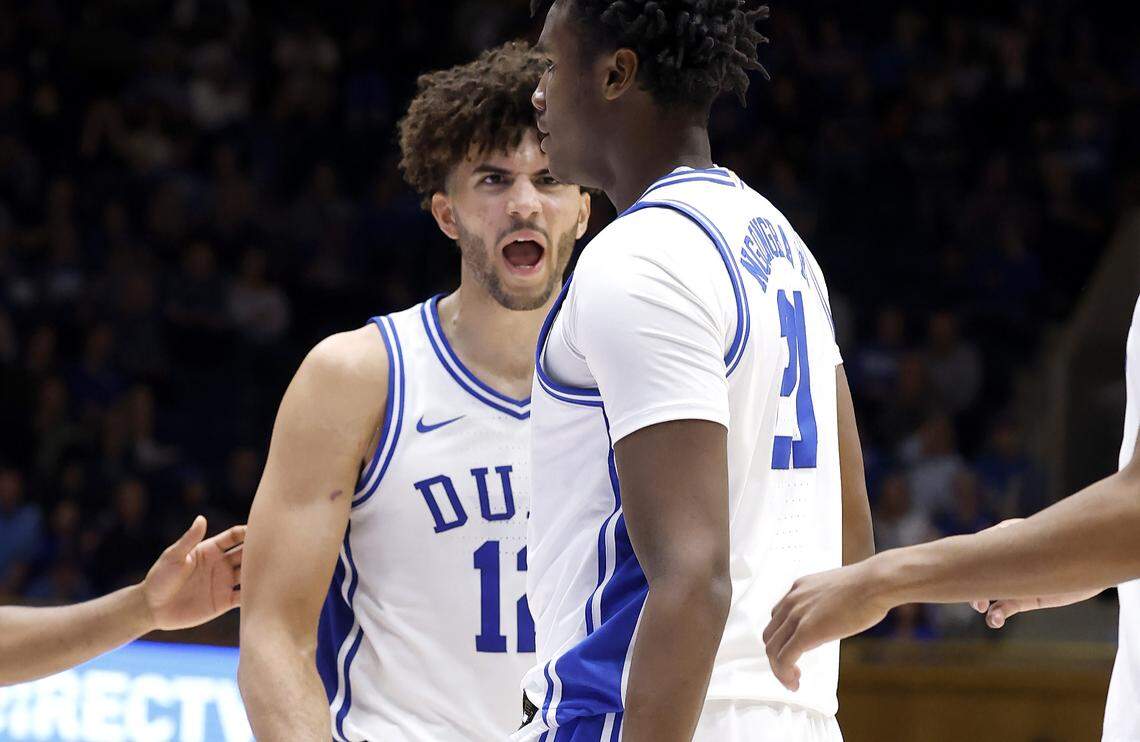 Duke’s Cameron Boozer (12) celebrates after Patrick Ngongba II (21) made the shot while being fouled during the second half of Duke’s 93-56 victory over Howard at Cameron Indoor Stadium in Durham, N.C., Sunday, Nov. 23, 2025.