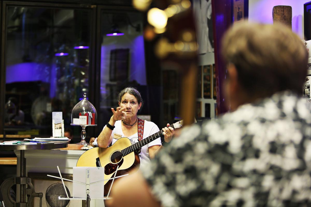 Vickie Posey, center, answers a question during the Handsome Ladies all-women bluegrass jam at the Larry’s Coffee headquarters in Raleigh on Tuesday, Sept. 11, 2018. Posey and her daughter, Lee Pike, started the Raleigh chapter this year after Posey, who had recently retired and was attending more jams, wished she saw more women at them.