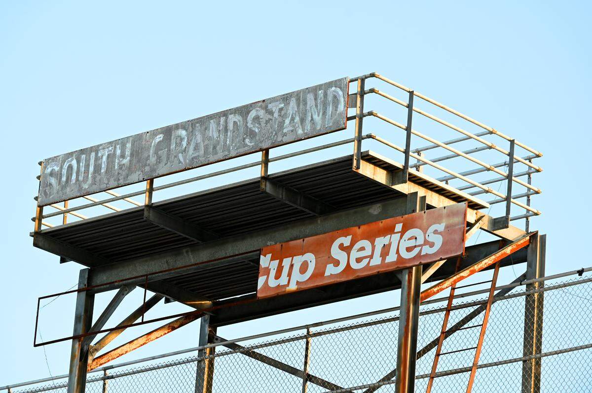 An old stand for the South Grandstand still hovers over seating at North Wilkesboro Speedway on Wednesday, May 10, 2023. The speedway held an open house for fans to see the new renovations to the track. North Wilkesboro Speedway will host the NASCAR All-Star race on Sunday, May 21, 2023. The last race ran at the speedway was in 1996.
