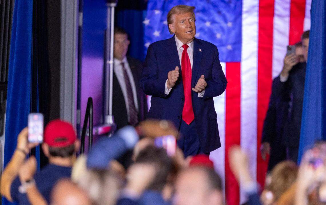 Former President Donald Trump takes the stage during a rally at Minges Coliseum in Greenville on Monday, Oct. 21, 2024. With two weeks until Election Day, Trump went on a three-city tour, in which Trump will also see the destruction caused by Hurricane Helene in Asheville and speak at a faith conference in Concord.