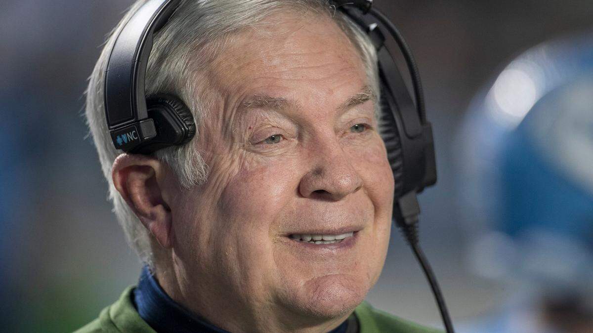 North Carolina coach Mack Brown smiles as he watches the coin toss prior to the kick off against Georgia Tech on Saturday, November 19, 2022 at Kenan Stadium in Chapel Hill, N.C.