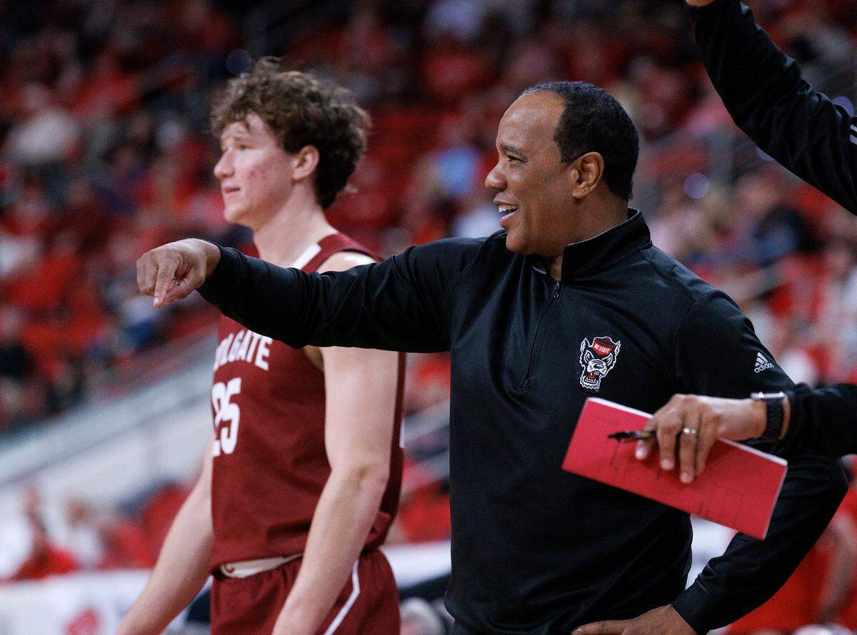 N.C. State head coach Kevin Keatts smiles on the sidelines during the second half of the Wolfpack’s 72-49 win over Colgate at Lenovo Center on Monday, Nov. 18, 2024, in Raleigh, N.C.