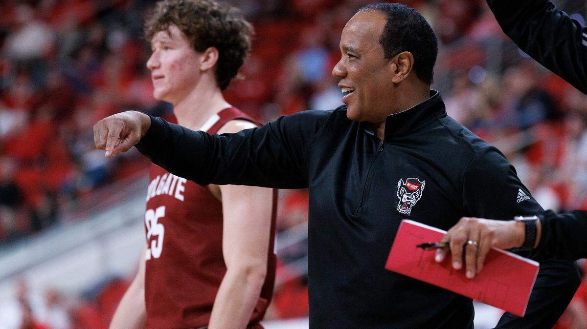 N.C. State head coach Kevin Keatts smiles on the sidelines during the second half of the Wolfpack’s 72-49 win over Colgate at Lenovo Center on Monday, Nov. 18, 2024, in Raleigh, N.C.