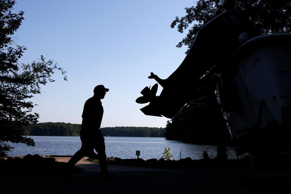 A law passed in the 2011 North Carolina budget says that state regulators cannot make air, water and other environmental rules that are stricter than those passed by the federal government. Here, Glenn Woodward, a laboratory analyst with Raleigh Water, prepares to collect monthly samples from Falls Lake on Tuesday, May 28, 2024.