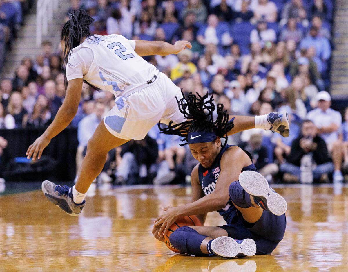 North Carolina’s Grace Townsend and UConn’s KK Arnold collide during the first half of the Tar Heel’s game on Friday, Nov. 15, 2024, at First Horizon Coliseum in Greensboro, N.C.