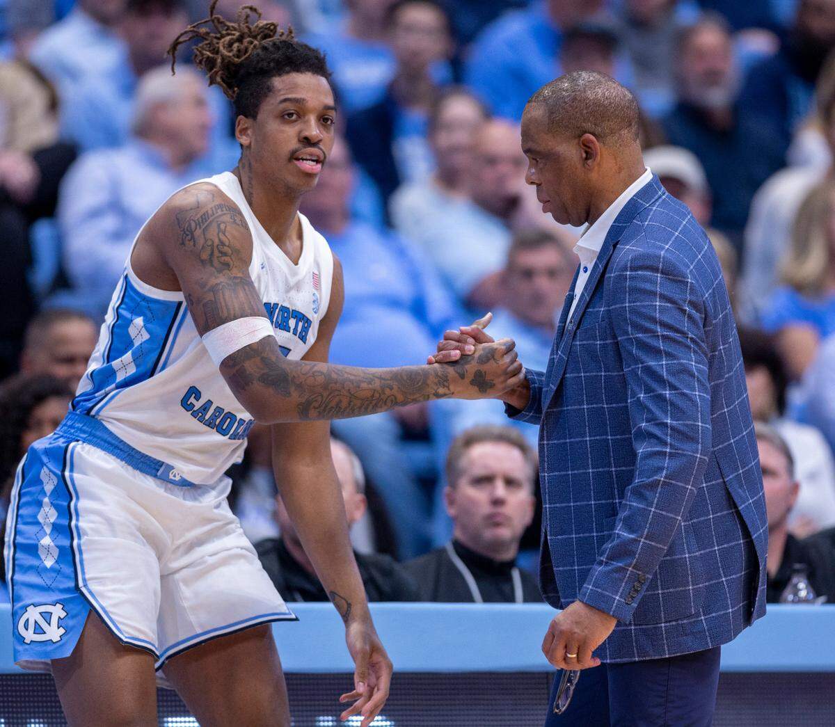North Carolina coach Hubert Davis shakes hands with Armando Bacot (5) in the second half against Lehigh on Sunday, November 12, 2023 at the Smith Center in Chapel Hill, N.C.