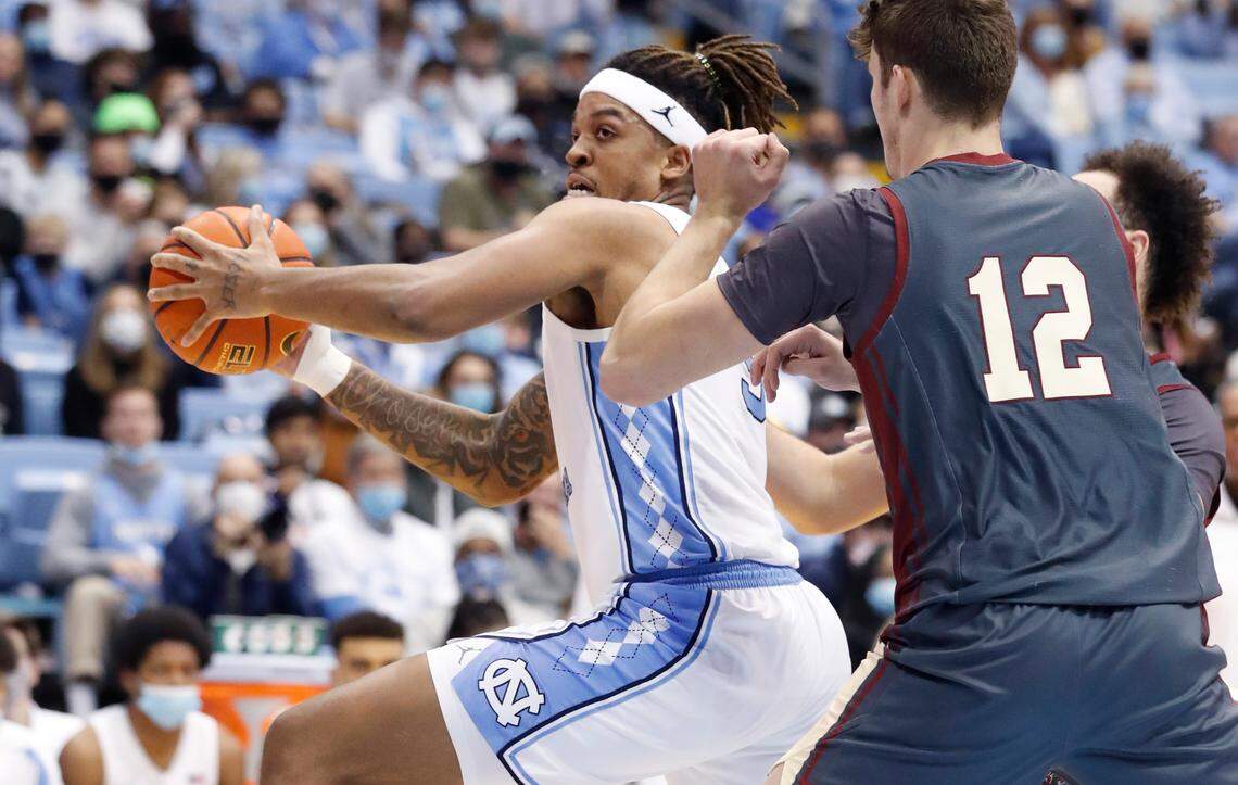North Carolina’s Armando Bacot (5) drives around Boston College’s Quinten Post (12) during the second half of UNC’s 58-47 victory over Boston College at the Smith Center in Chapel Hill, N.C., Wednesday, Jan. 26, 2022.