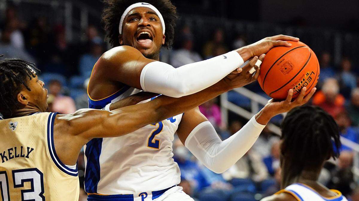 Pittsburgh Panthers forward Blake Hinson (2) drives to the basket against Georgia Tech Yellow Jackets guard Miles Kelly (13) during the first half of the second round of the ACC tournament at Greensboro Coliseum.