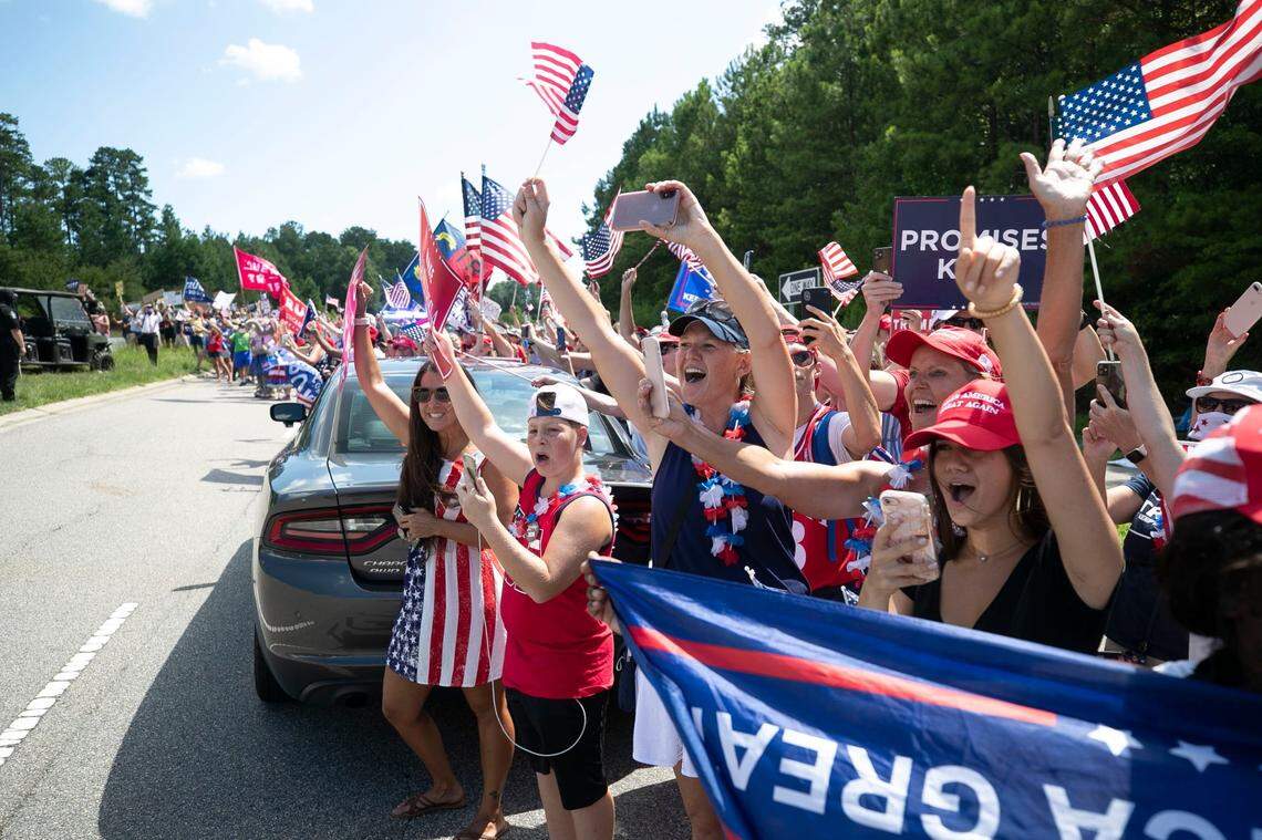 Nearly 300 supporters of President Trump line Davis Drive near the entrance Fujifilm Diosynth, welcoming the president’s arrival on Monday, July 27, 2020 in Morrisville, N.C. Trump is scheduled to make a visit to Fujifilm Diosynth where they are are manufacturing a COVID-19 vaccine for Novavax.
