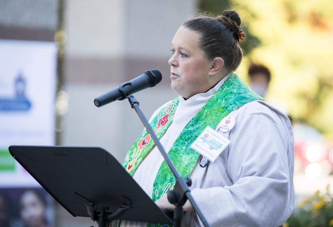 Executive Director of Pastors for NC Children, Rev. Suzanne Parker Miller, speaks to a crowd gathered for a prayer vigil for children and the funding of the Leandro Plan in Bicentennial Plaza in Raleigh, N.C. on Monday, Oct. 18, 2021.