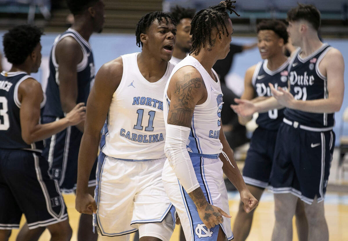 North Carolina’s Day’Ron Sharpe (11) reacts after a basket by teammate Armando Bacot (5) during the first half against Duke on Saturday, March 6, 2021 at the Smith Center in Chapel Hill, N.C.