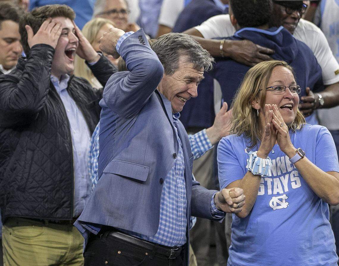 North Carolina Governor Roy Cooper relishes in North Carolinas 81-77 victory over Duke in the NCAA Final Four semi-final on Saturday, April 2, 2022 at Caesars Superdome in New Orleans, La.