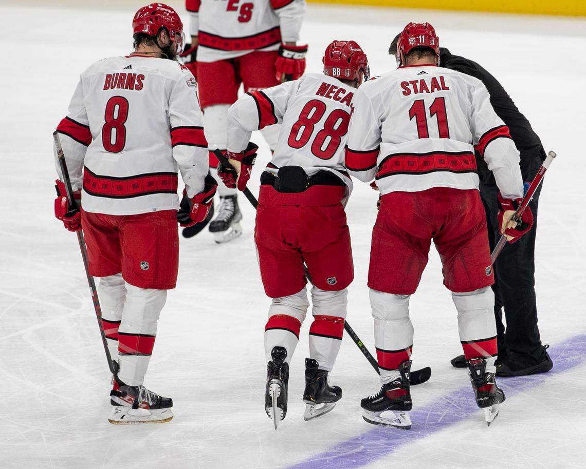 The Carolina Hurricanes Martin Necas (88) is escorted off the ice after an injury in the in the second period to take a 3-2 lead during Game 4 of the Eastern Conference Finals on Wednesday, May 24, 2023 at FLA Live Arena in Sunrise, Fla.