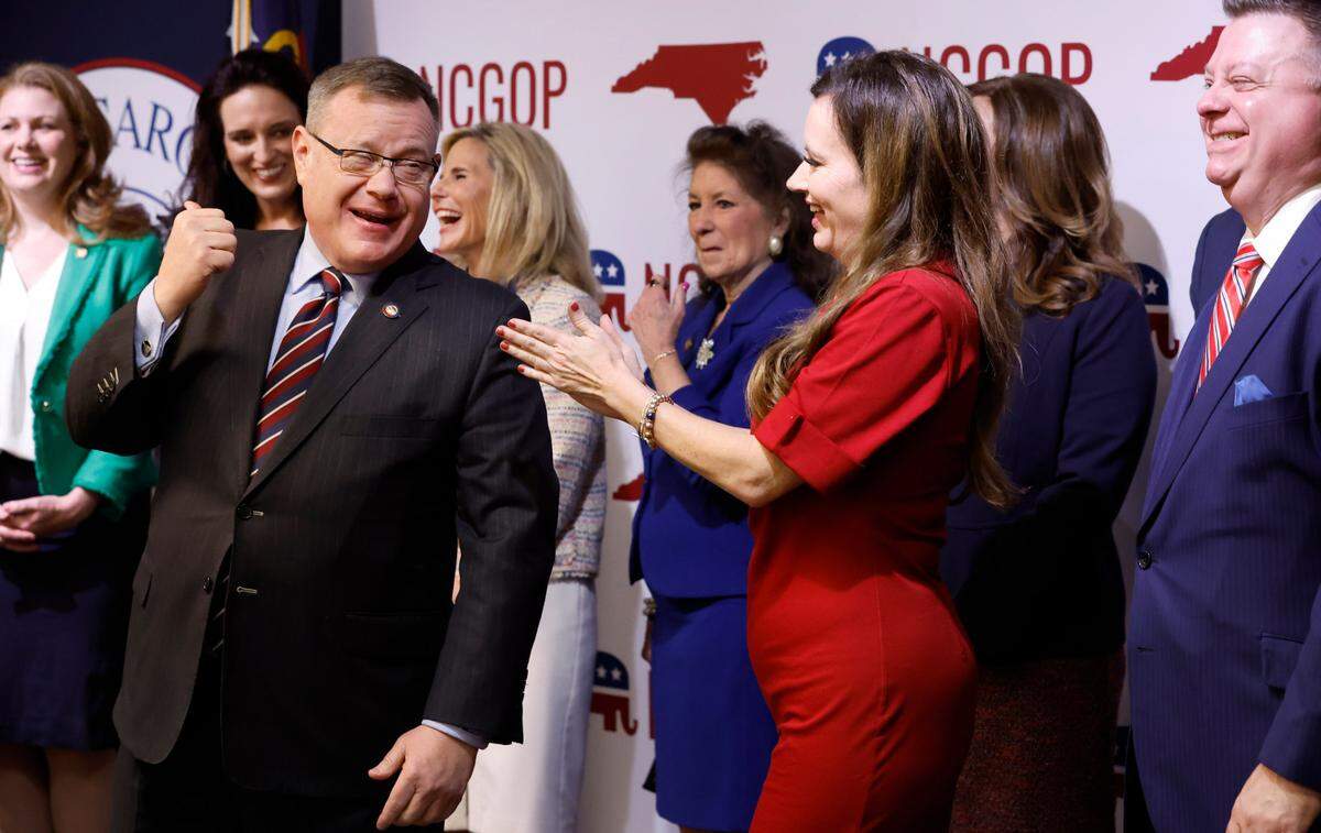 N.C. House Speaker Tim Moore, left, laughs with N.C. State Rep. Tricia Cotham as they talk with N.C. Senate leader Phil Berger during a press conference Wednesday, April 5, 2023. The press conference was to announce Rep. Cotham is switching parties to become a member of the House Republican caucus.
