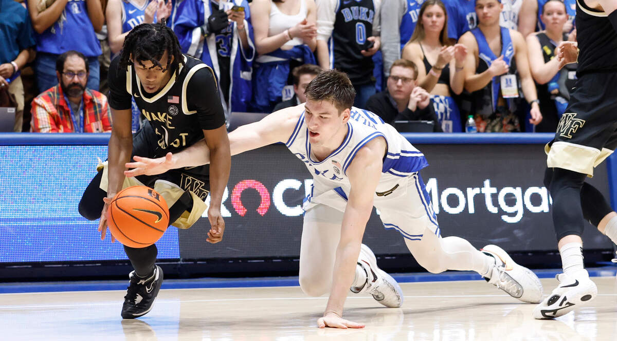 Duke’s Kyle Filipowski (30) and Wake Forest’s Tyree Appleby (1) go after the ball during the second half of Duke’s 75-73 victory over Wake Forest at Cameron Indoor Stadium in Durham, N.C., Tuesday, Jan. 31, 2023.